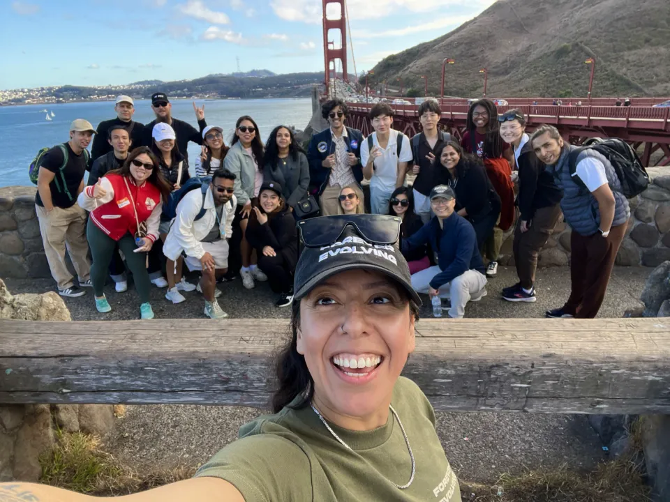 Zulma with a group on a walk at the Golden Gate Bridge