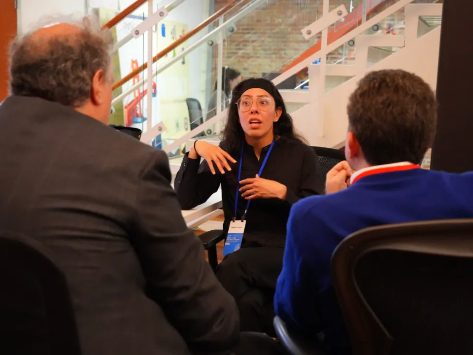 Zulma advising two founders at a startup mentoring event