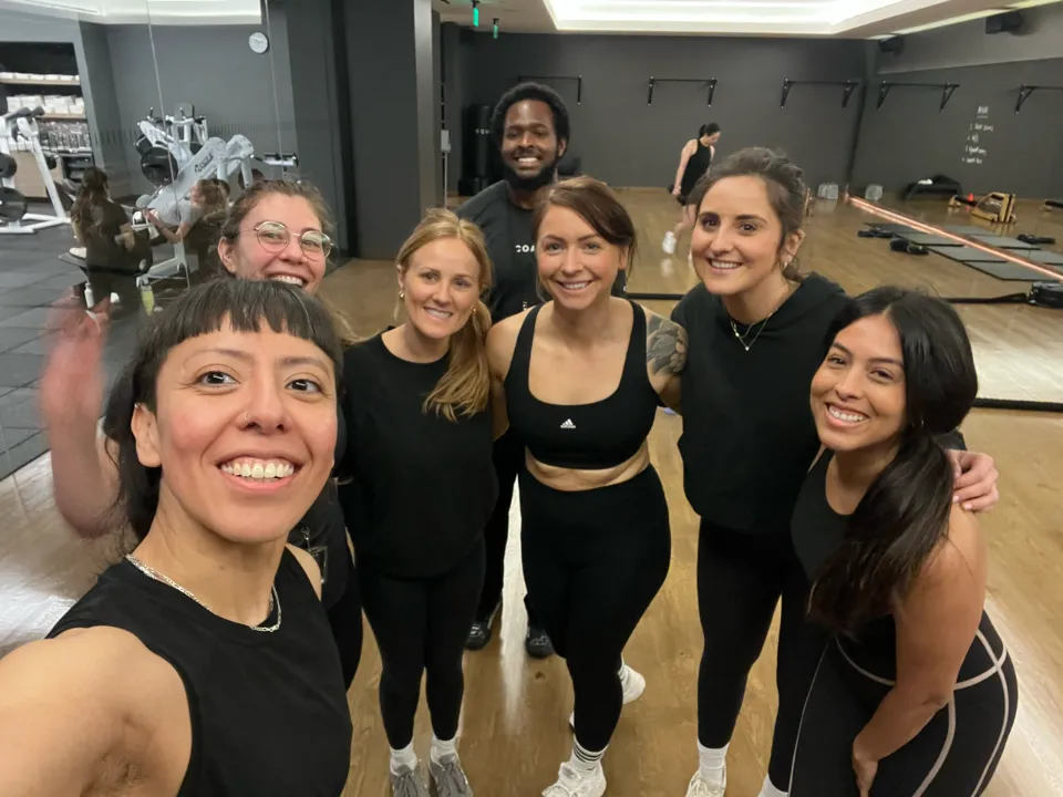Zulma with participants after a group TRX class